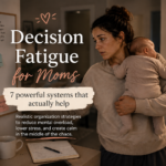 Overwhelmed mother holding her baby at night while managing household planning and mental load, representing decision fatigue for moms.