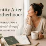 Mother sitting at a table reflecting on personal growth and identity after motherhood while her children play in the background.